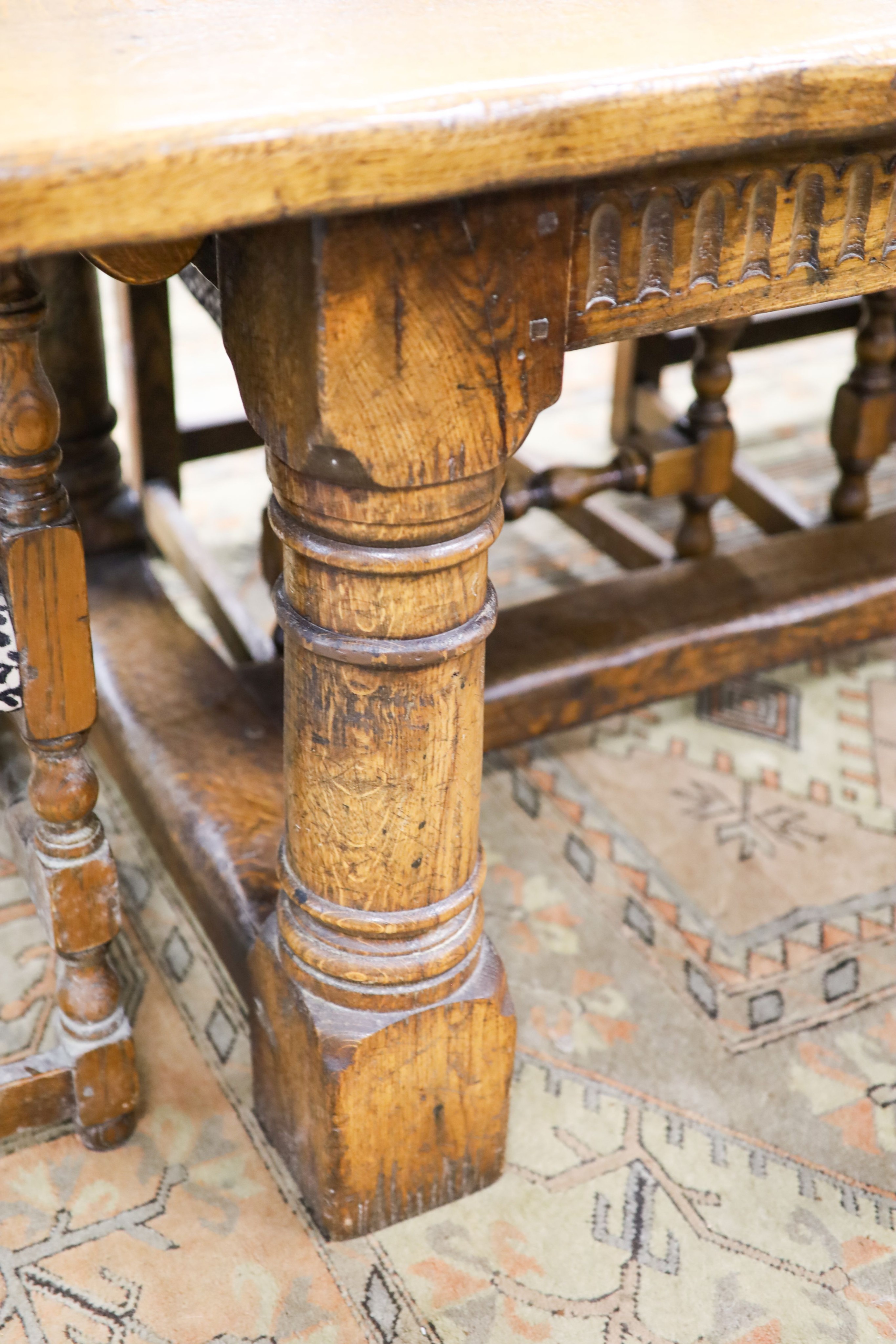 An 18th century style pale oak refectory dining table, length 305cm, depth 90cm, height 76cm